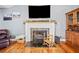 Cozy living room with fireplace and hardwood floors at 113 Emerald Pines Dr, Dallas, GA 30157