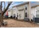 View of the home's backyard, featuring a patio area, outdoor furniture and well-maintained landscaping at 2427 Millbank Ct, Lawrenceville, GA 30043