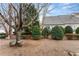 Landscaped backyard with mature trees and plenty of green space at 2427 Millbank Ct, Lawrenceville, GA 30043