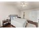 Comfortable bedroom with wood floors, vaulted ceilings, ceiling fan, and ensuite bathroom at 2427 Millbank Ct, Lawrenceville, GA 30043