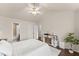 Bright bedroom with a vaulted ceiling, ceiling fan, walk-in shower, and modern farmhouse decor at 2427 Millbank Ct, Lawrenceville, GA 30043