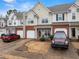 Charming townhome with a well-manicured front yard, featuring a garage and inviting front porch at 2427 Millbank Ct, Lawrenceville, GA 30043
