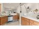 Bright kitchen with stainless steel appliances and a view of the dining area and staircase, perfect for entertaining at 2427 Millbank Ct, Lawrenceville, GA 30043