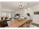 Open-concept living area with hardwood floors, dining table, and cozy seating at 2427 Millbank Ct, Lawrenceville, GA 30043