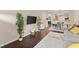 Expansive living room featuring hardwood floors and a combined living and dining area at 2427 Millbank Ct, Lawrenceville, GA 30043
