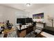 Functional home office setup with a large desk, multiple monitors, and ample workspace at 2427 Millbank Ct, Lawrenceville, GA 30043