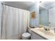 Cozy bathroom with blue wallpaper, a shower and tub, and a clean white toilet and sink at 917 Edgewater Cir, Marietta, GA 30062