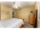 Bedroom features queen bed, ceiling fan, natural light from window, and neutral color palette at 917 Edgewater Cir, Marietta, GA 30062