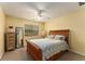 Bedroom features queen bed, carpet, ceiling fan, natural light, and neutral color palette for cozy retreat at 917 Edgewater Cir, Marietta, GA 30062