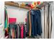 Well-organized closet with shelving and hanging storage for clothing and accessories at 917 Edgewater Cir, Marietta, GA 30062