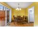 Dining room with a wooden table and chairs next to a sliding door, offering a cozy dining experience at 917 Edgewater Cir, Marietta, GA 30062