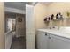 Convenient laundry room with modern washer, dryer, and ample storage for supplies at 917 Edgewater Cir, Marietta, GA 30062