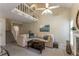 Open concept living room with a fireplace, sofa, high ceilings, and a staircase leading to an upper level at 917 Edgewater Cir, Marietta, GA 30062