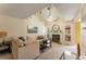 Comfortable living room boasts high ceilings, fireplace, plush sofa, and a ceiling fan for added relaxation at 917 Edgewater Cir, Marietta, GA 30062