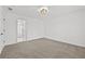 Spacious carpeted bedroom featuring neutral paint, carpet, and access to other rooms at 1303 Angel Falls Sw Ln, Atlanta, GA 30311