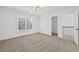 Bright carpeted bedroom featuring walk-in closet and natural light at 1303 Angel Falls Sw Ln, Atlanta, GA 30311