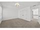 Comfortable bedroom with carpet, window, closet and modern lighting at 1303 Angel Falls Sw Ln, Atlanta, GA 30311