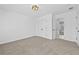 Bright bedroom with carpet, light fixture, closet and open entry to a bath at 1303 Angel Falls Sw Ln, Atlanta, GA 30311