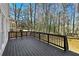 Spacious deck with wood plank flooring, offering an ideal spot for outdoor entertaining and relaxation at 1303 Angel Falls Sw Ln, Atlanta, GA 30311