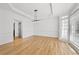 Dining room featuring hardwood floors, wainscoting, tray ceiling, and modern lighting at 1303 Angel Falls Sw Ln, Atlanta, GA 30311