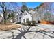 Two-story home featuring a long concrete driveway leading to a two car garage at 1303 Angel Falls Sw Ln, Atlanta, GA 30311