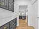 The hallway leads to a contemporary kitchen with dark cabinets and sleek stainless steel appliances at 1303 Angel Falls Sw Ln, Atlanta, GA 30311