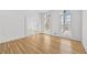 Sunlit living room showcasing hardwood floors, large windows, and neutral decor at 1303 Angel Falls Sw Ln, Atlanta, GA 30311