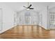 Open living room featuring hardwood floors, a ceiling fan, and lots of windows at 1303 Angel Falls Sw Ln, Atlanta, GA 30311