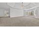 A spacious main bedroom features large windows, neutral carpet and high ceilings at 1303 Angel Falls Sw Ln, Atlanta, GA 30311
