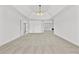 A spacious main bedroom with lots of natural light and neutral carpet at 1303 Angel Falls Sw Ln, Atlanta, GA 30311