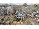 Overhead shot of a beautiful two-story home with classic architectural design surrounded by trees at 1386 Wesley Nw Cir, Atlanta, GA 30327