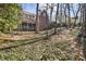Picturesque backyard with a manicured lawn and view of the brick home's exterior at 1386 Wesley Nw Cir, Atlanta, GA 30327