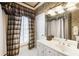 Full bathroom has decorative wallpaper and tiled floors, with a soaking tub and shower combo at 1386 Wesley Nw Cir, Atlanta, GA 30327