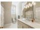 Bright bathroom with marble countertops, patterned wallpaper, and modern fixtures at 1386 Wesley Nw Cir, Atlanta, GA 30327