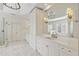Spacious bathroom with a marble countertop, double vanity, a glass shower and large soaking tub at 1386 Wesley Nw Cir, Atlanta, GA 30327