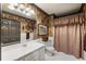 Full bathroom with a shower, patterned wallpaper, and unique fixtures at 1386 Wesley Nw Cir, Atlanta, GA 30327