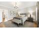 Bright bedroom boasts wood flooring, neutral decor, and large windows that bring in natural light at 1386 Wesley Nw Cir, Atlanta, GA 30327