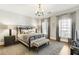 Serene bedroom featuring neutral color palette, hardwood floors, and abundant natural light at 1386 Wesley Nw Cir, Atlanta, GA 30327