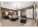 Relaxing bedroom with neutral walls, carpet, chandelier, and plantation shutters allowing plenty of natural light at 1386 Wesley Nw Cir, Atlanta, GA 30327