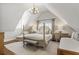 Cozy bedroom with a four poster bed, natural light, and a charming chandelier at 1386 Wesley Nw Cir, Atlanta, GA 30327
