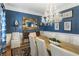 Elegant dining room boasts a chandelier, blue walls, and seating for eight at 1386 Wesley Nw Cir, Atlanta, GA 30327