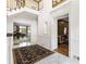 Grand foyer with marble floors, staircase, and elegant architectural details at 1386 Wesley Nw Cir, Atlanta, GA 30327