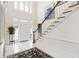 Bright foyer features high ceiling, marble floor, and view of the second story at 1386 Wesley Nw Cir, Atlanta, GA 30327
