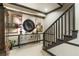 Hallway featuring carpeted stairs, dark trim, and a decorative table with a mirror at 1386 Wesley Nw Cir, Atlanta, GA 30327