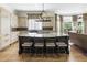 Gourmet kitchen featuring a large island with seating, custom cabinetry, and high-end appliances at 1386 Wesley Nw Cir, Atlanta, GA 30327