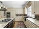 Beautiful kitchen featuring a large island, stainless steel appliances, and custom cabinets at 1386 Wesley Nw Cir, Atlanta, GA 30327