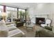 Cozy living room featuring a fireplace, built-in cabinets, and french doors to outside at 1386 Wesley Nw Cir, Atlanta, GA 30327