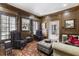 Wood paneled library room with custom built-in shelving and seating at 1386 Wesley Nw Cir, Atlanta, GA 30327