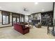 Spacious living room with large windows, a fireplace, built-in bookshelves and dark trim at 1386 Wesley Nw Cir, Atlanta, GA 30327