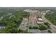 Extensive aerial shot shows neighborhood's layout, roads, and location near businesses and green spaces at 375 Banbury Xing, Alpharetta, GA 30009